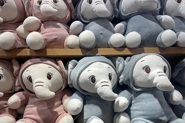 Plush Elephant Toys in Pink and Blue Hooded Outfits