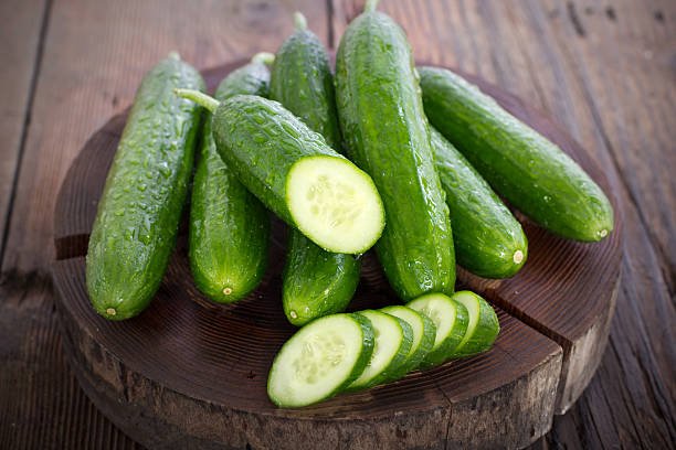 Fresh cucumber on the wooden table